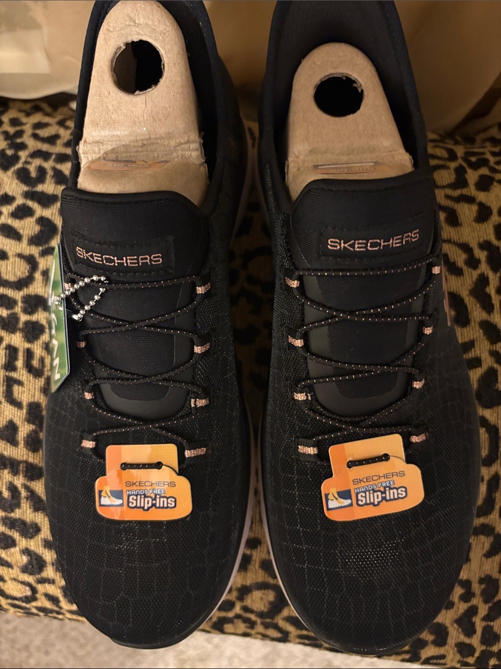 Skechers Women’s Black Slip-On Sneakers with Rose Gold Accents